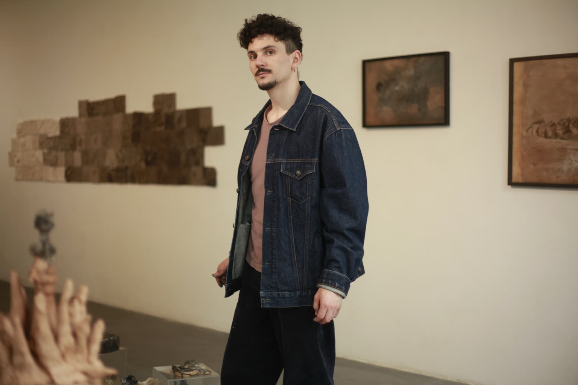 Gaspar Aveta in his exhibition, among his ceramic works