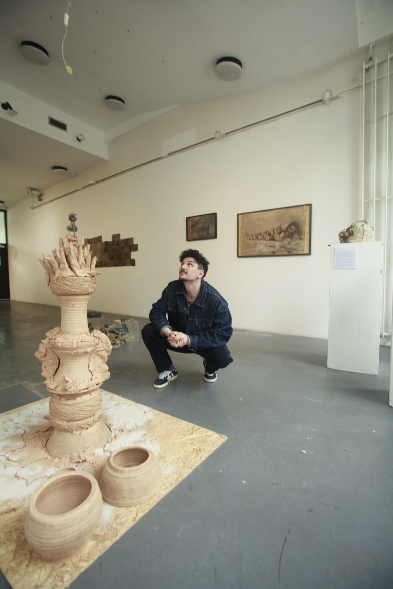 Gaspar Aveta in his exhibition, among his ceramic works